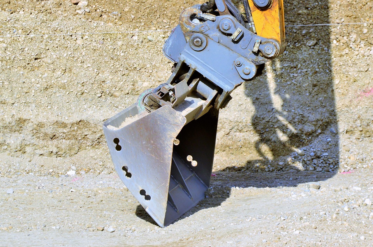Excavator grading a site on schedule in Waco, TX